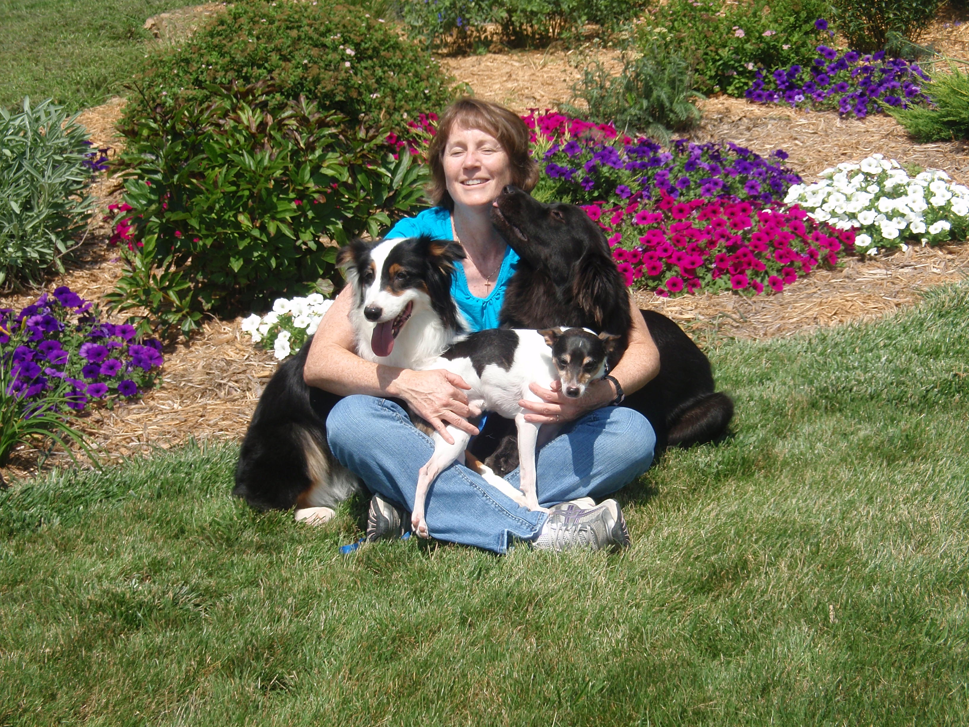 COLLEEN S. KOCH, DVM, DACVB PICTURED WITH PANDA, SCOOTER AND BEN